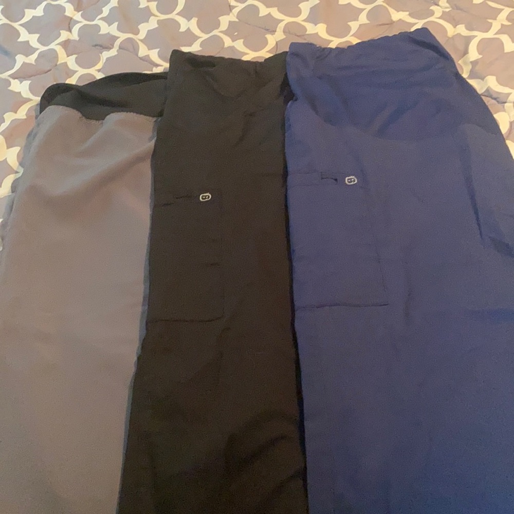 - Maternity scrub pants. Wink brand with belly bands. Size xl one pair is XXL